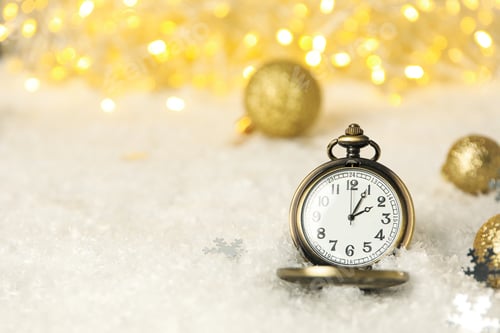 Preview: Pocket watch with snow on a light background.