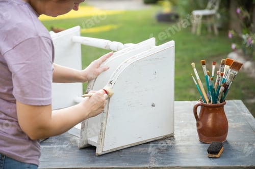 Preview: Painting a wooden furniture outdoors, an eco-friendly re-use business.