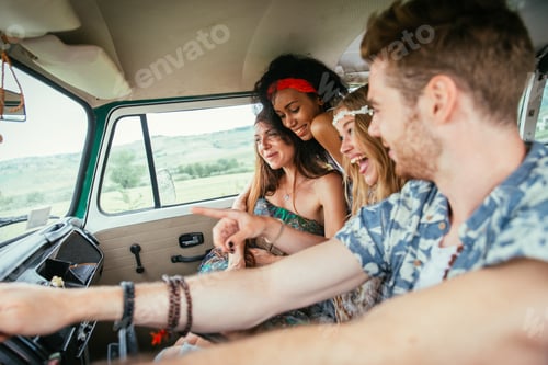 Preview: Happy friends driving a vintage minivan