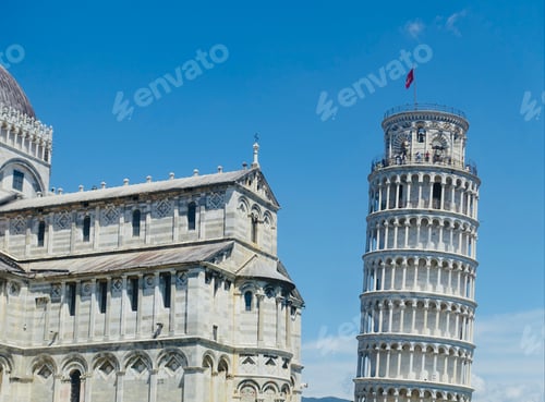 Preview: Leaning tower of Pisa and Pisa Cathedral against blue sky on a sunny day in Pisa, Tuscany, Italy