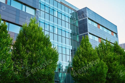 Preview: Modern office building with green trees