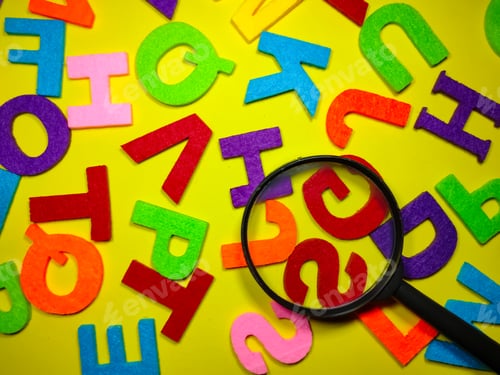 Preview: Selective focus.Magnifying glass and colorful word on black background