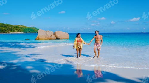 Preview: Praslin Seychelles tropical island with white beach, couple men and women on vacation