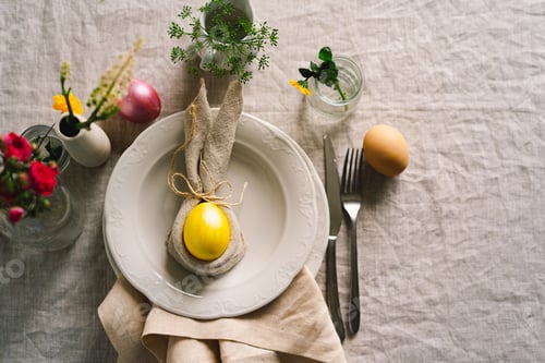 Preview: Happy Easter. Stylish easter eggs on a napkin with spring flowers on white wooden background