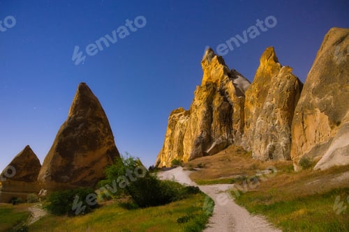 Preview: Rocks and the sky with stars. View of the rocks at night. Landscape in the summertime.