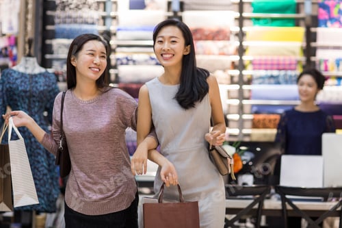 Preview: Best female friends shopping in clothing store