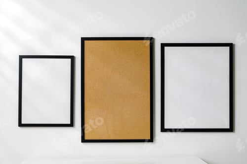Preview: Three blank frames with copy space hanging on white wall