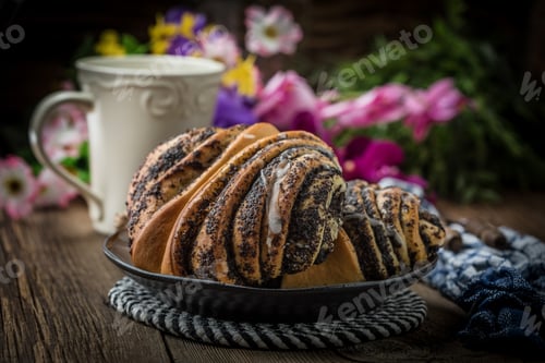Preview: Sweet buns with poppy seed and frosting.