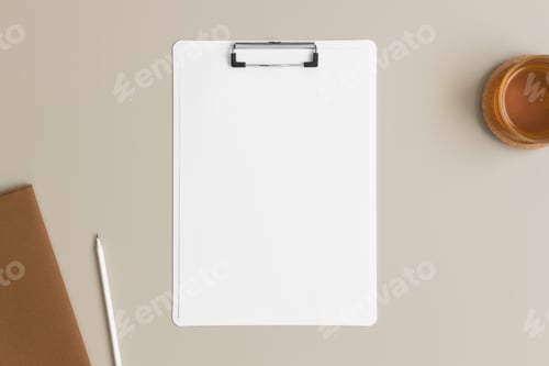 Preview: White clipboard mockup with a cup of tea and workspace accessories on a beige table.