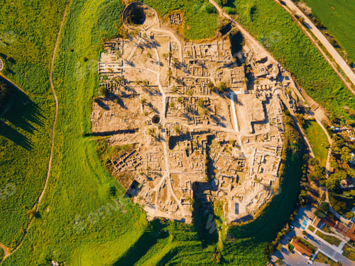 Preview: Aerial view of Tel Megiddo, the ancient Armageddon site, surrounded by lush green landscapes