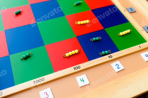 Preview: Detail of montessori material, a checker board with tiles and beads.