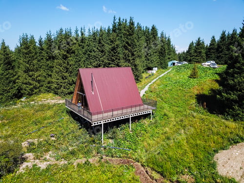 Preview: Aerial view of chalet cottages in mountain resort