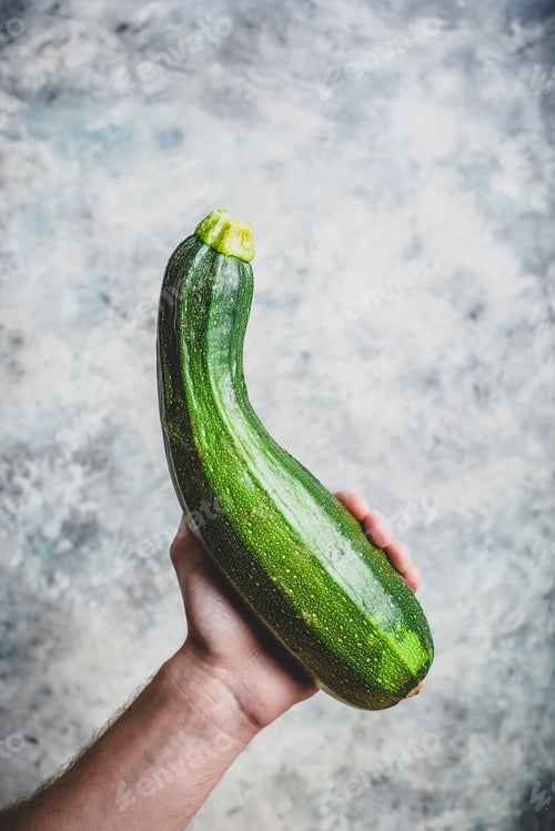 Preview: Hand holding zucchini
