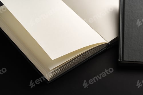 Preview: Black hardcover book or notepad mock up on black background
