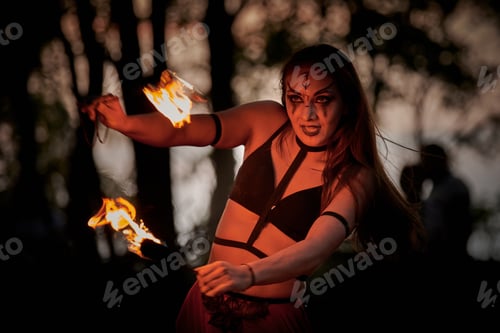 Preview: Girl fire dancing performance at outdoor art festival, smooth movements of female artist