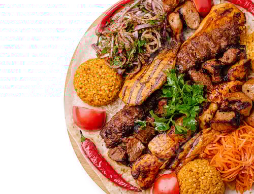 Preview: Delicious mixed grill platter featuring meats, rice, and fresh vegetables