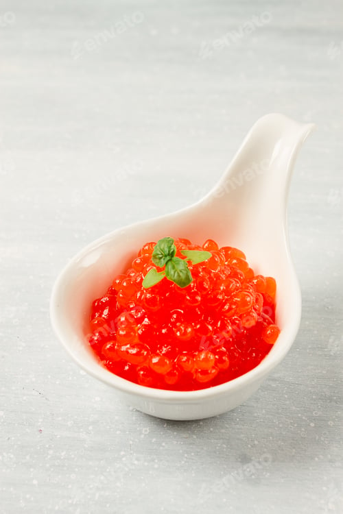 Preview: Red caviar, imitation, on a light background, close-up, no people,