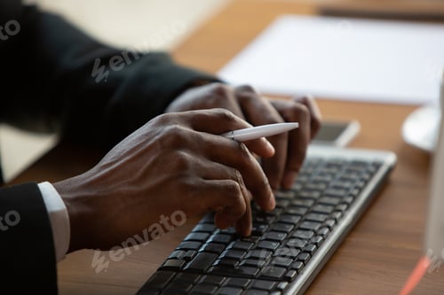 Preview: African-american entrepreneur, businessman working concentrated in office