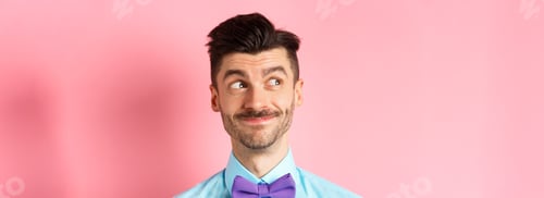Preview: Close-up of handsome smiling guy with moustache, looking left at logo with pleased face, standing