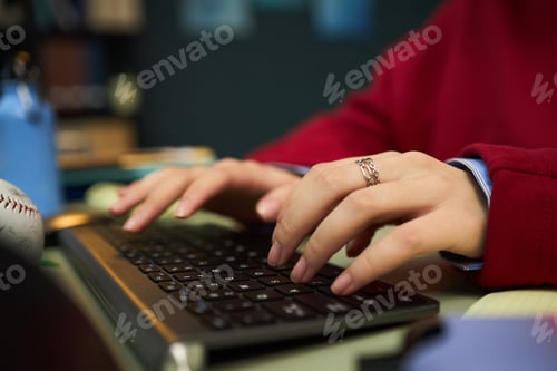 Preview: Young Adult Woman Typing on Wireless Keyboard in Office Setting