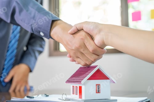 Preview: Real estate agents and buyers handshake after signing a business contract, renting, buying