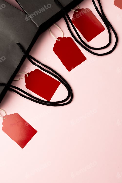Preview: Composition of gift tags and bags with copy space on white background