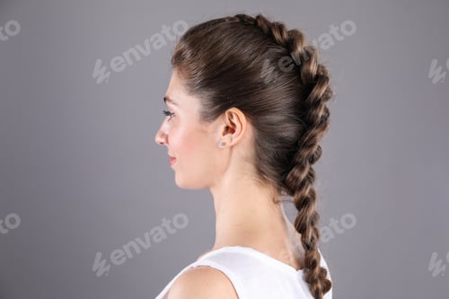 Preview: Woman with braided hair on grey background