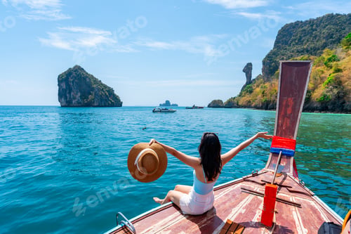 Preview: Young Asian woman relaxing and enjoying at Chicken island in Krabi Thailand
