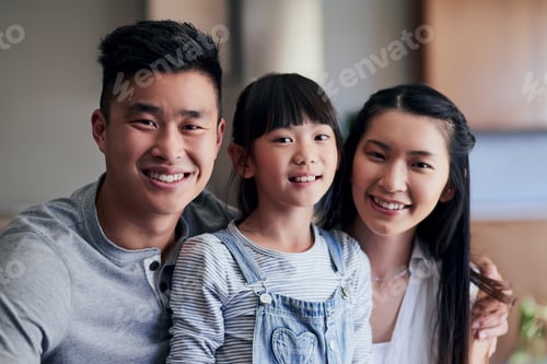 Preview: Were just a happy family. Portrait of a happy family bonding together at home.