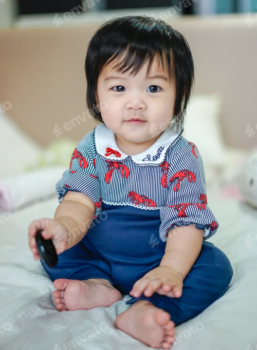 Preview: Beautiful baby girl smiling happily.