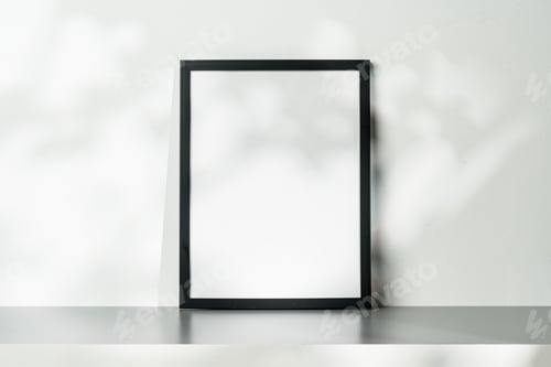 Preview: Blank wooden frame mock up on desk near white wall