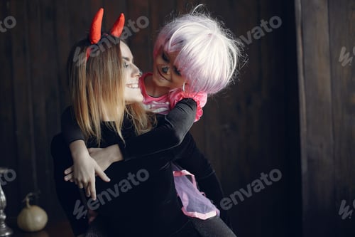 Preview: Mother with daughter in a halloween costume and makeup