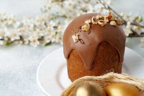 Preview: Ester cake with chocolate topping and nuts on gray background