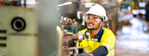 Preview: professional technician engineer working in industrial manufacturing factory, machinery production