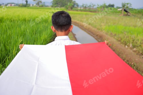 Preview: Child Holding Red and White Fabric in Field