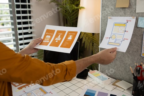Preview: A web developer is analyzing data from his ideas to develop the structure and components of a digita