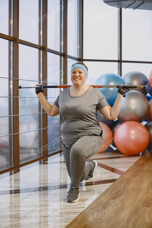 Preview: Adult fat woman doing gymnastics at the gym