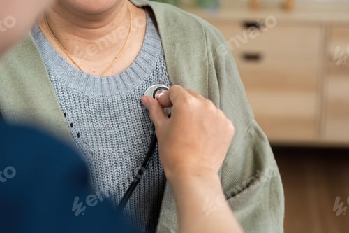 Preview: Close-Up of Doctor Using Stethoscope on Patient During Medical Examination in Clinic