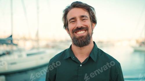 Preview: Frontal closeup of happy young hipster male looking at camera