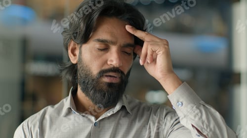 Preview: Close-up frustrated tired stressed indian business man male businessman office employee feeling
