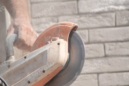 Preview: motion blur working concrete saw for sawing bricks of the right size
