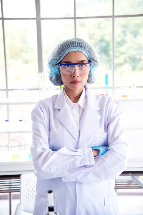 Preview: Woman scientist in lab look at science microscope medical test and research biology chemistry
