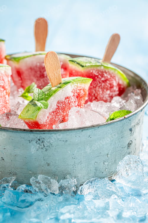 Preview: Homemade and juicy watermelon ice cream on a stick.