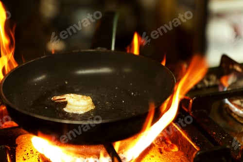 Preview: Cooking delicious shrimp with butter and spices on frying pan