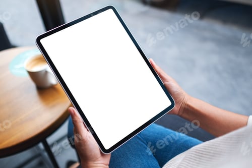 Preview: Mockup image of a woman holding digital tablet with blank white desktop screen