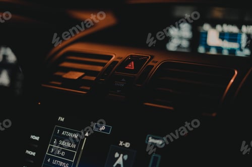 Preview: Illuminated Car Dashboard with Radio Display at Night
