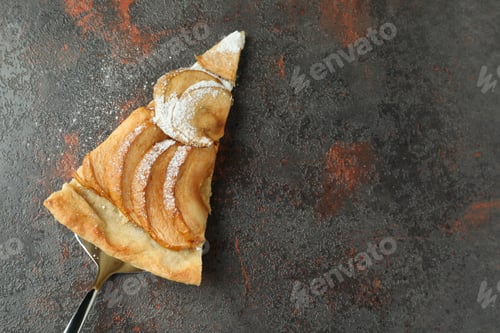 Preview: Cake spoon with slice of apple pie on textured background