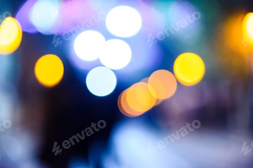 Preview: Defocused urban night background with colorful circles.