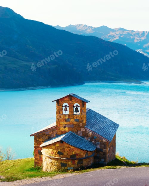 Preview: Picturesque view of stone chapel on Roselend lake