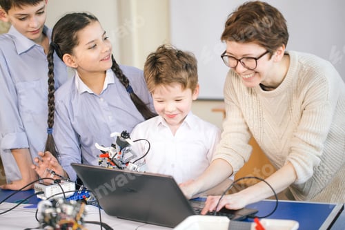 Preview: Happy children learn programming using laptops on extracurricular classes